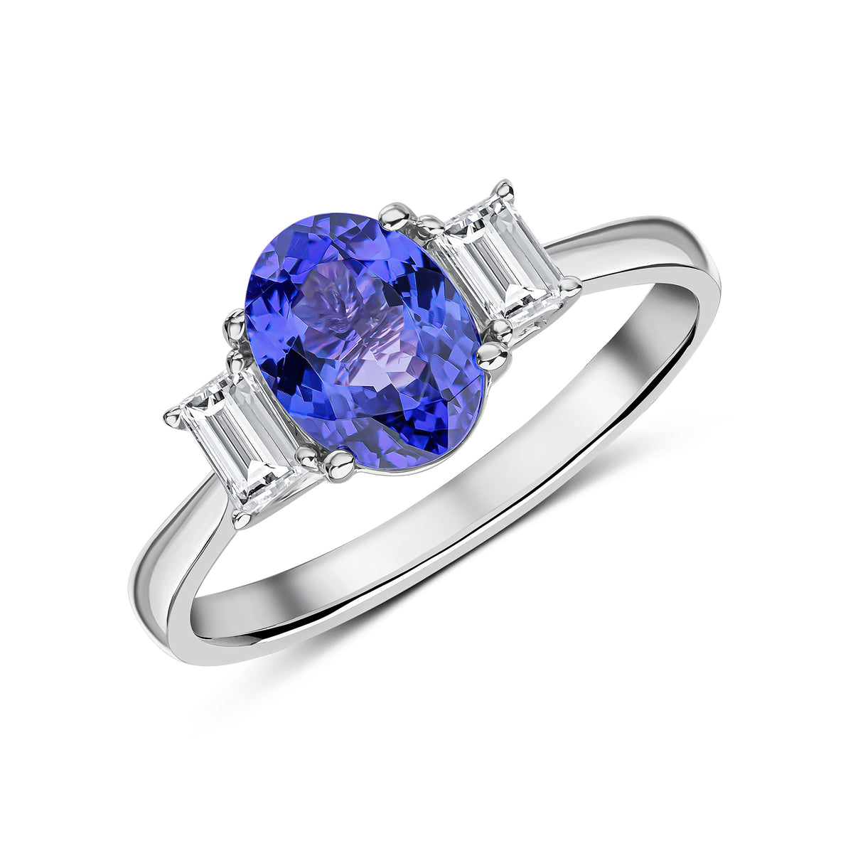 18CT WG 8X6 OVAL TANZANITE AND BAGUETTE DIAMOND CLAW SET 3ST RING
