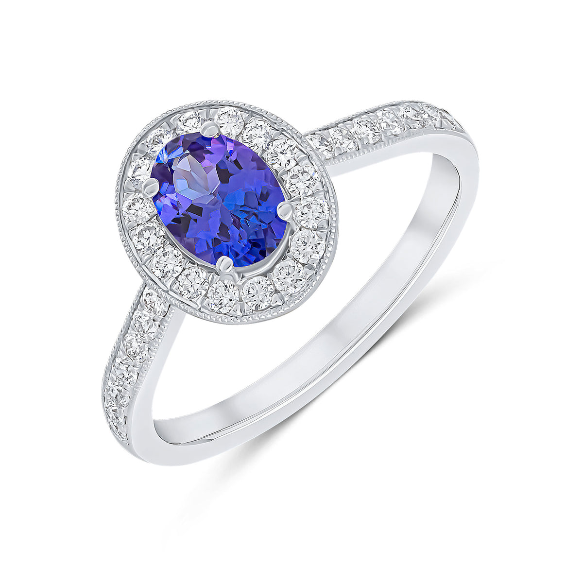 18CT WG CLAW SET 7X5 OVAL TANZANITE AND MILLEGRAIN ROUND DIAMOND CLUSTER RING WITH MILLEGRAIN DIAMOND SET SHOULDERS