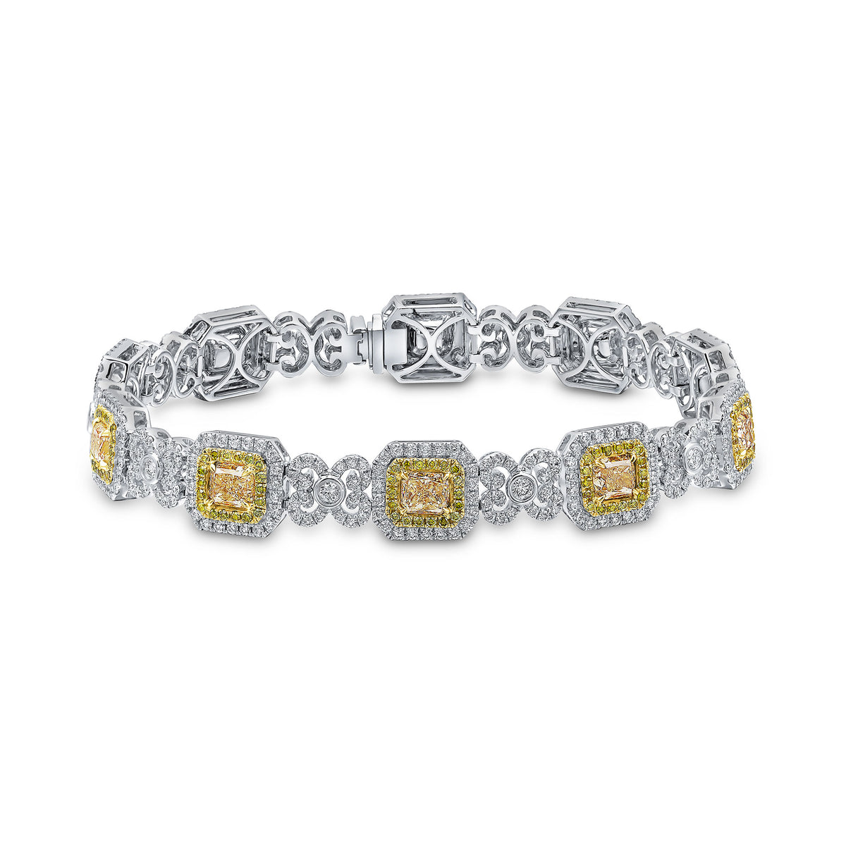 18CT YELLOW AND WHITE GOLD RADIANT AND ROUND YELLOW DIAMOND AND ROUND DIAMOND CLUSTERS AND SCROLLS BRACELET. ALL CLAW SET