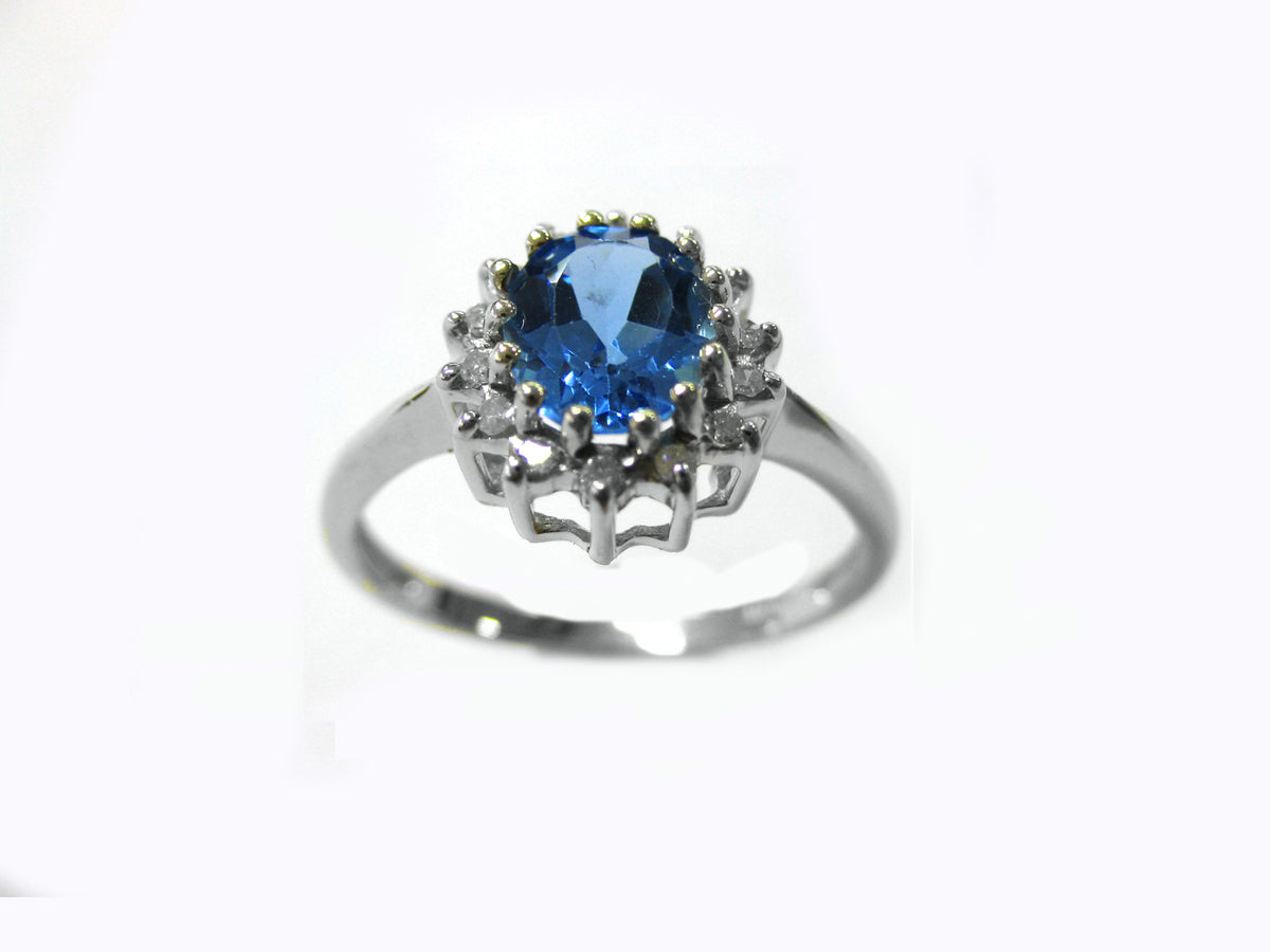 9CT WG 8X6 OVAL TANZANITE & DIAMOND CLAW SET CLUSTER RING