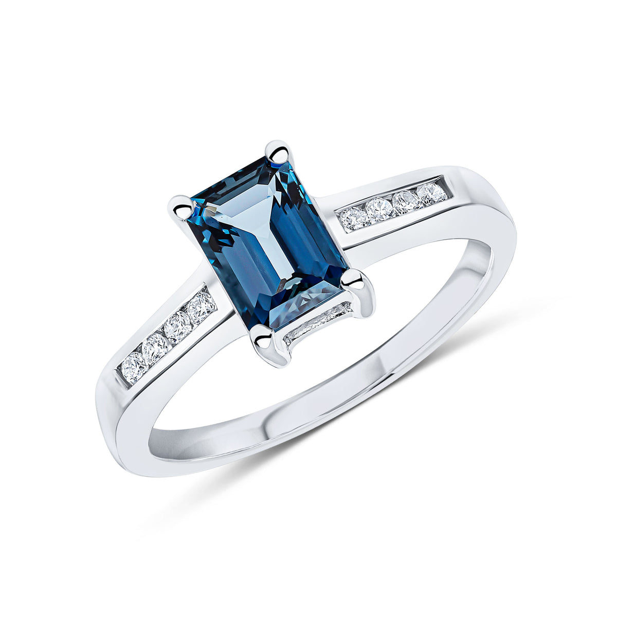 9CT WG 7X5 OCTAGON LONDON BLUE TOPAZ CLAW SET SINGLE STONE RING WITH CHANNEL SET DIAMOND SHOULDERS