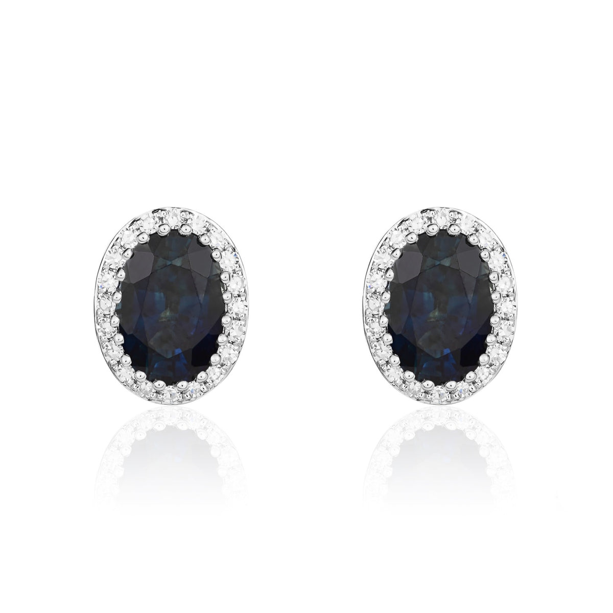 9CT WG 7X5 OVAL SAPPHIRE AND ROUND DIAMOND CLAW CLUSTER EARRINGS