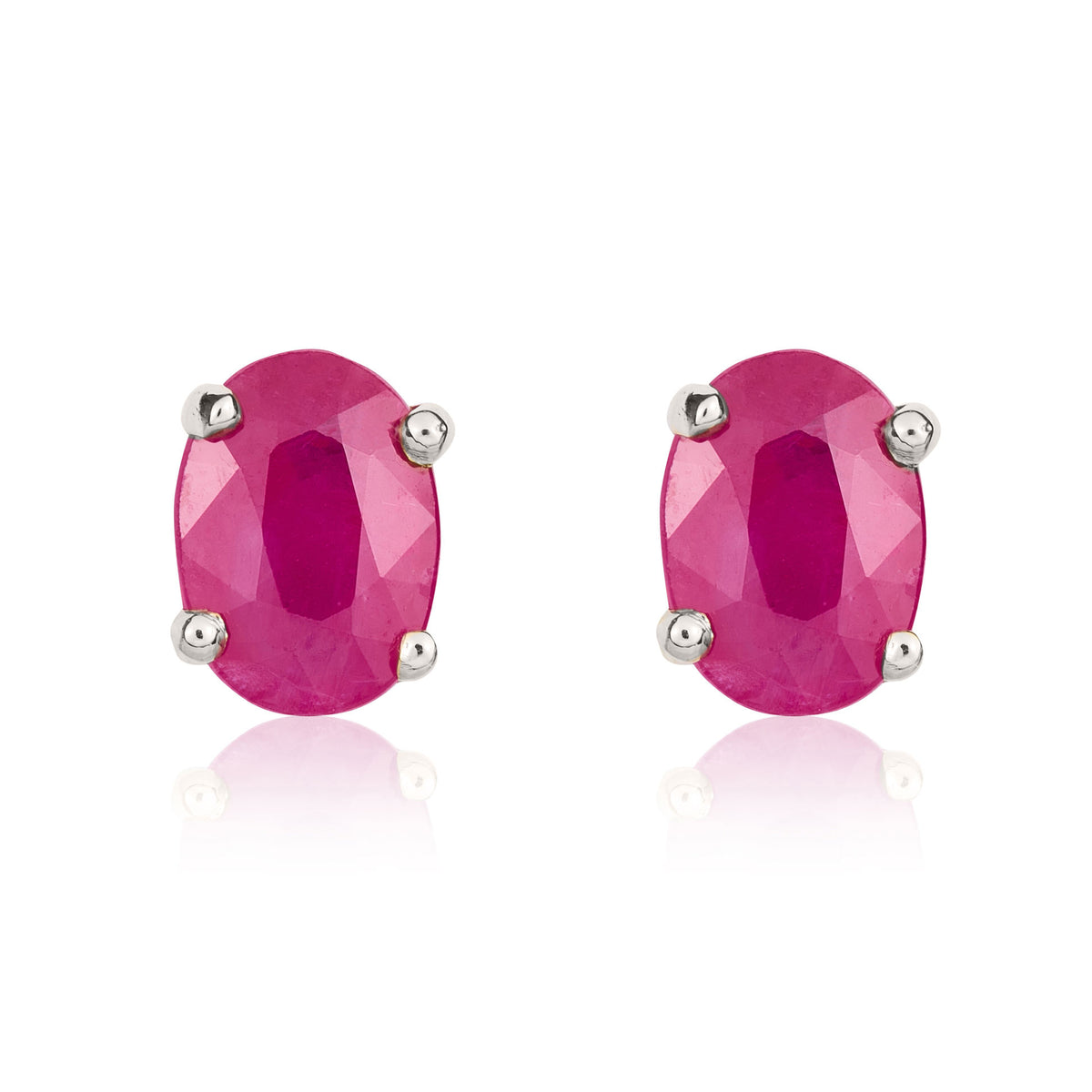9CT WHITE GOLD 7X5MM OVAL RUBY CLAW EARRINGS