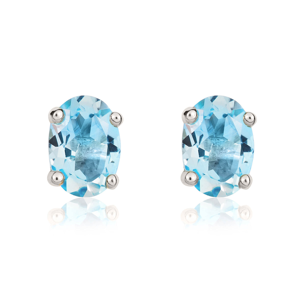 9CT WG 7X5MM OVAL SWISS BLUE TOPAZ CLAW SET STUD EARRINGS