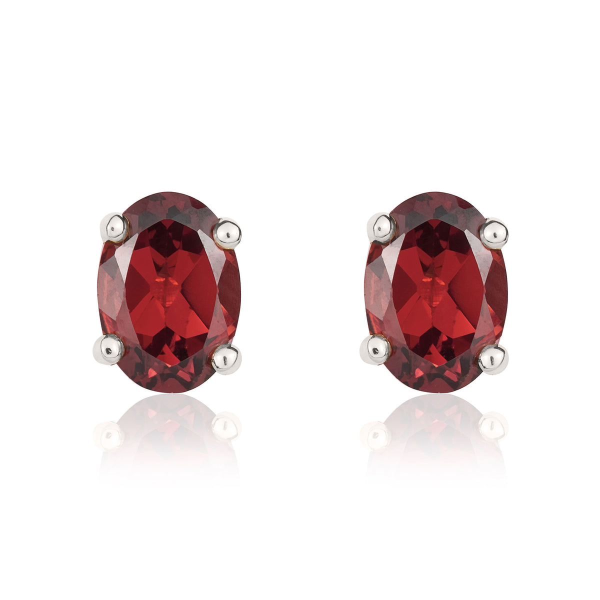 9CT WG 7X5 OVAL GARNET CLAW STUD EARRINGS