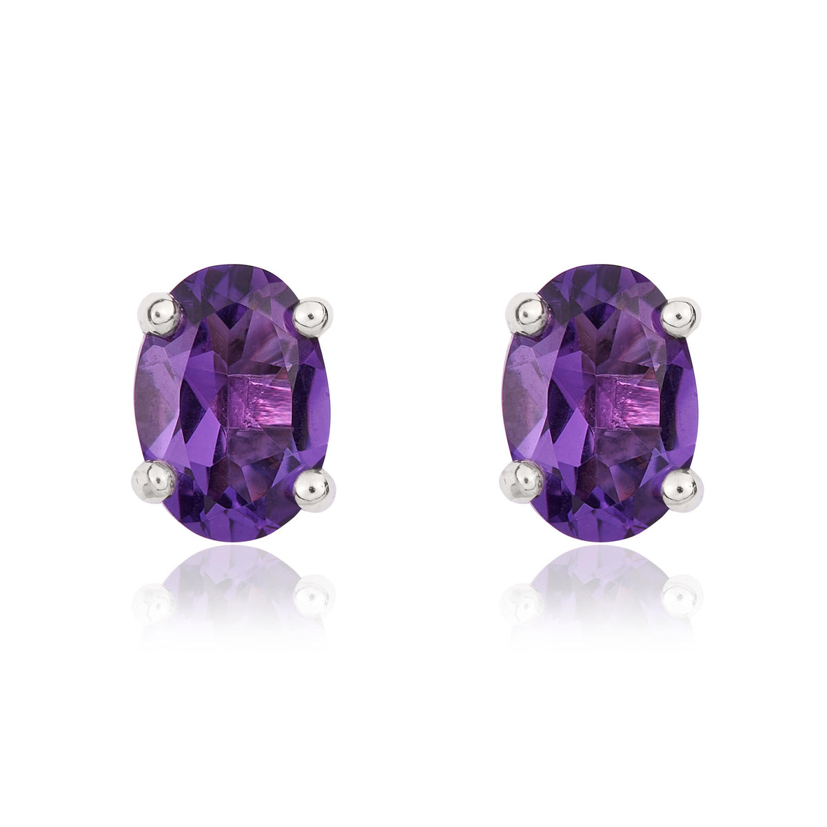 9CT WG 7X5 OVAL AMETHYST CLAW STUD EARRINGS