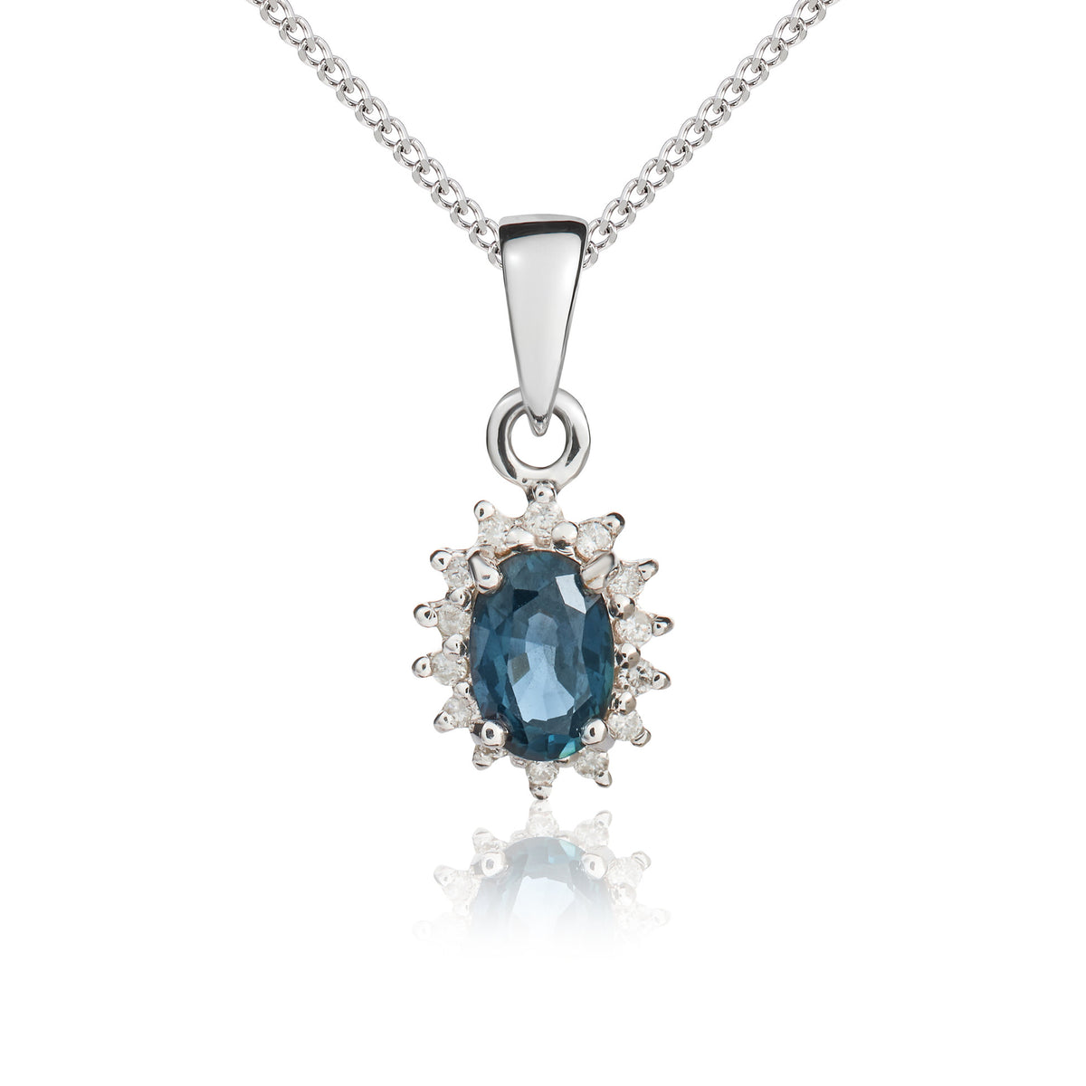9CT WG 6X4 OVAL SAPPHIRE & DIAMOND CLAW SET CLUSTER PENDANT