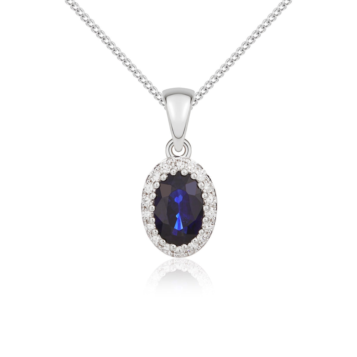9CT WHITE GOLD OVAL SAPPHIRE AND DIAMOND CLAW CLUSTER PENDANT